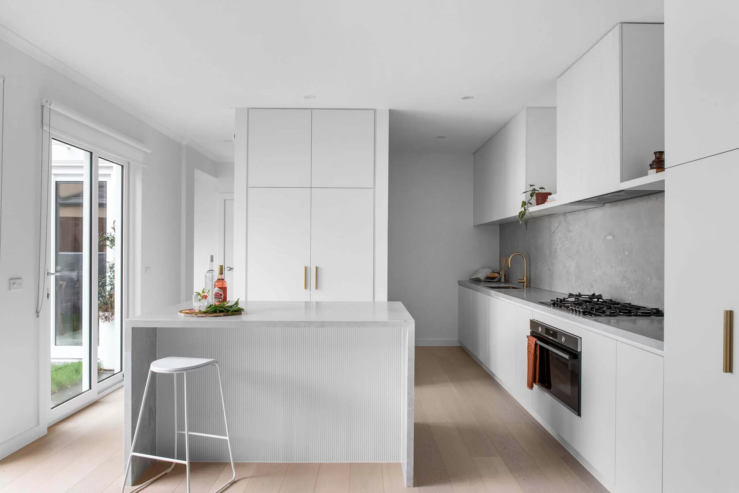 Contemporary kitchen design with island bench and premium appliances in Sydney