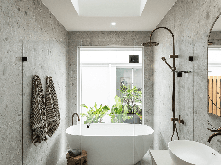 Bathroom renovation Sydney - modern double vanity bathroom with brass tapware and freestanding bath by Artistic Bathroom & Kitchen Renovations